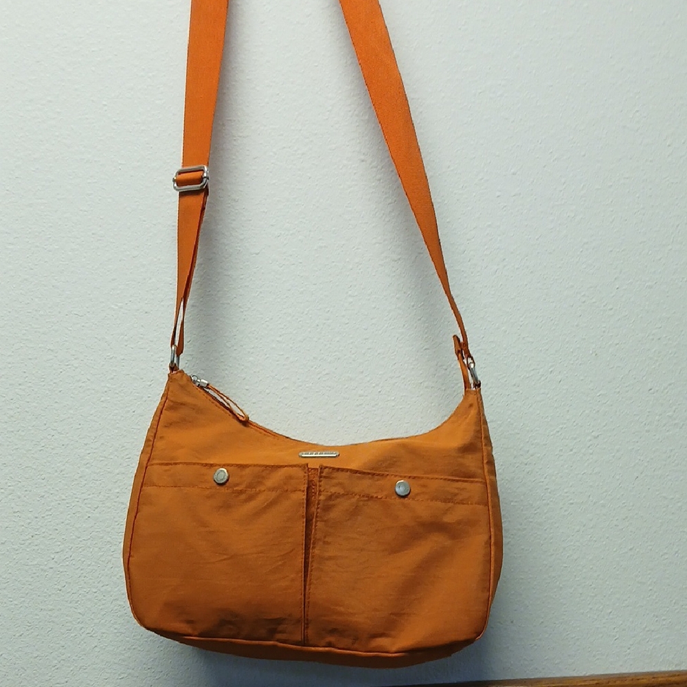 🌸 BAGGALINI Orange Crossbody Bag with Adjustable Strap and Durable Fabric